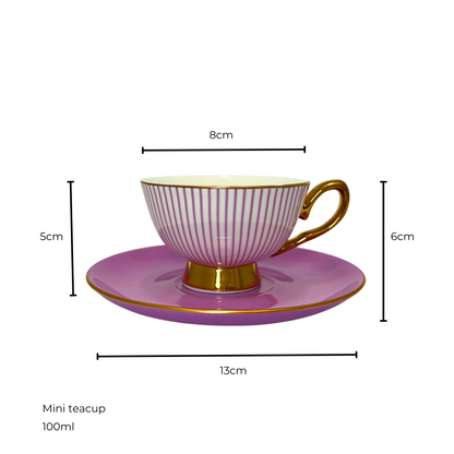 White and purple striped teacup with gold handle and edges sitting on matching on a purple saucer.  Isolated on a white background. Measurements shown of 8cm teacup diameter and 5cm height, saucer diameter 13cm and 6cm height of saucer and teacup