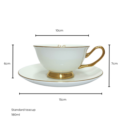 White teacup with gold handle and edges sitting on matching white and gold saucer.  Isolated on a white background. Measurements shown of 10cm teacup diameter and 6cm height, saucer diameter 15cm and 7cm height of saucer and teacup