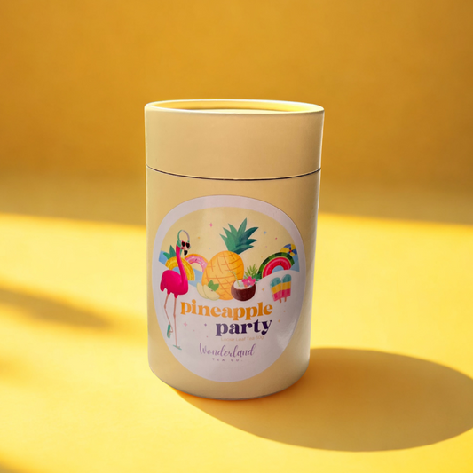 Wonderland Tea Co Premium Loose Leaf Tea - Pineapple Party 30g on yellow studio background with shadowing from natural light