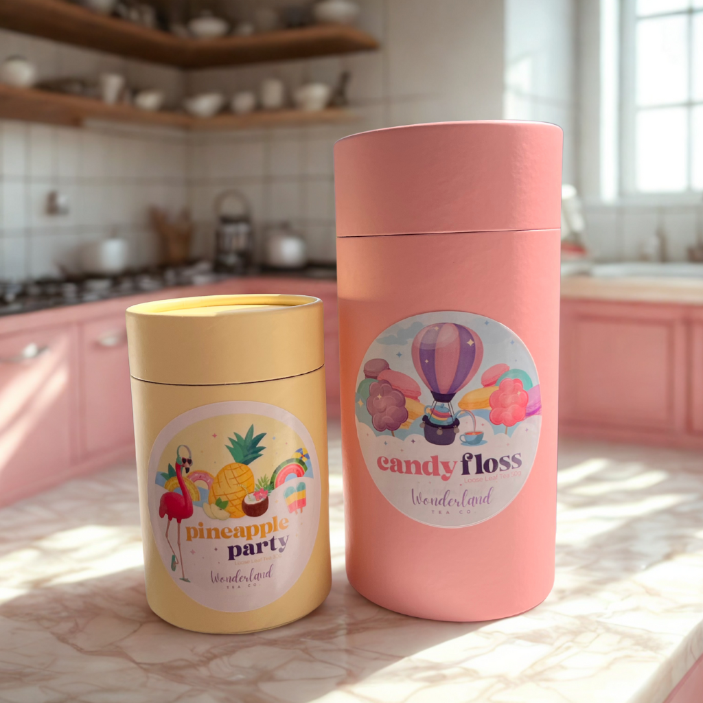 Wonderland Tea Co Tea flavours Candy Floss and Pineapple Party sitting on a marble kitchen benchtop.  Lifestyle Shot in a beautiful neutral and pink kitchen